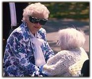 caregiver talking to an elderly woman